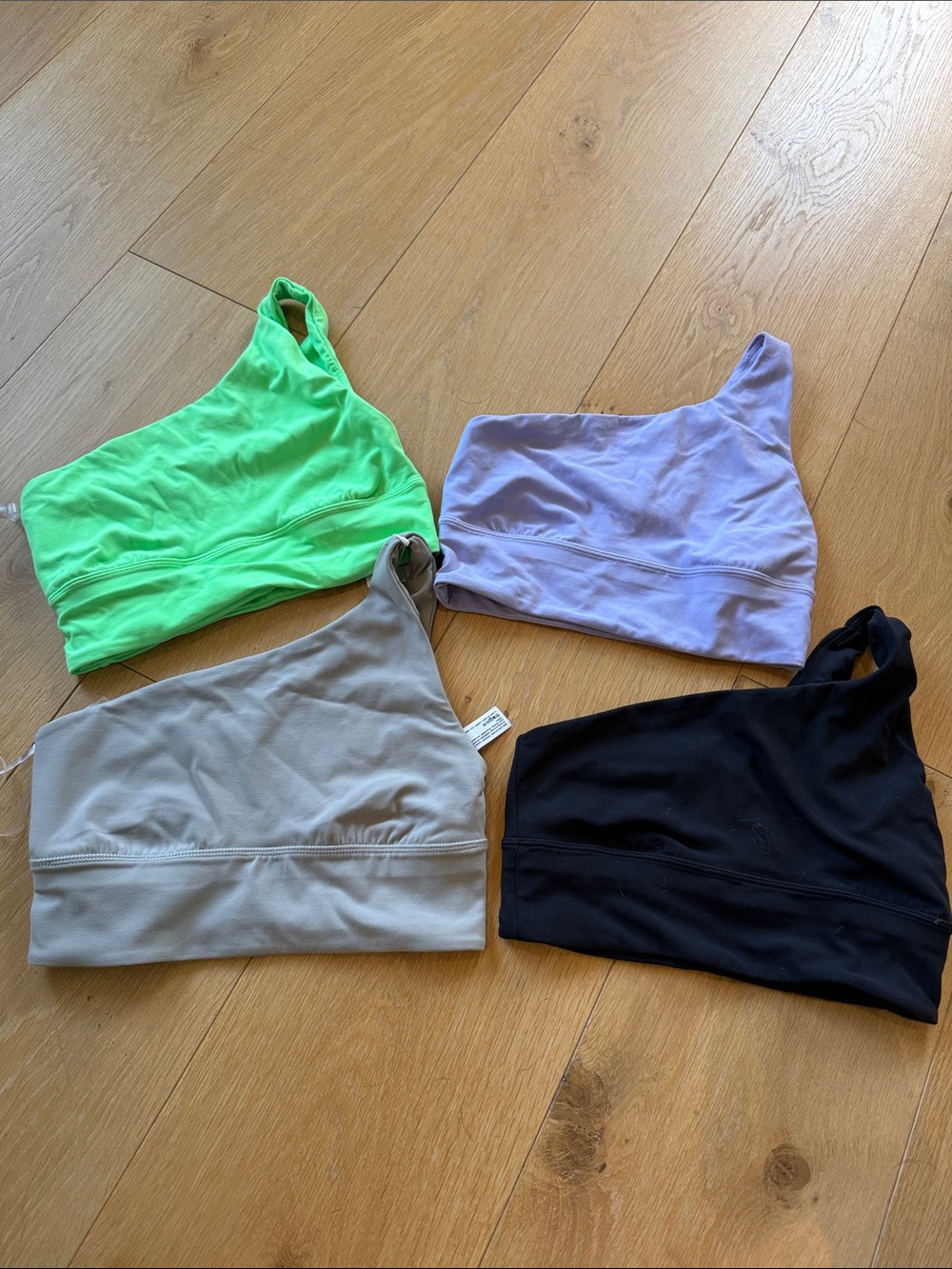 One-Shoulder Sports Bras Set in Neon Green, Lavender, Gray, and Black
